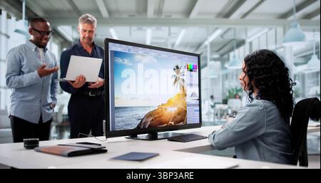 Multiracial Woman Collaborating With Diverse Team On Web Design Stock Photo