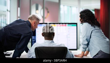 Diverse Development Team Collaborating On Kanban Board In Office Space. Stock Photo
