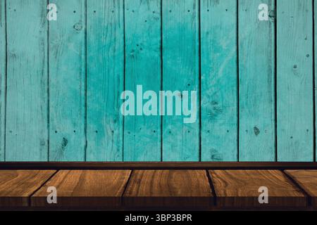 Wooden tabletop is featuring brown planks under weathered turquoise wall in flat design, copy space Stock Photo