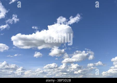 White clouds cumulus heap clouds in front of blue sky, international Stock Photo
