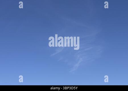 Delicate thin veil clouds Cirrus in front of blue sky. international Stock Photo