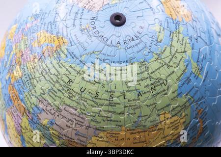Puzzle globe. Map made from puzzle pieces. Russia Stock Photo