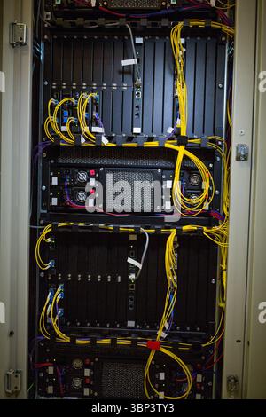 Server rack cabinet is being shown in vector illustration, with yellow fiber and patch cables Stock Photo