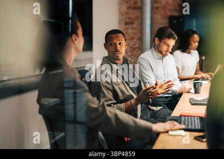 Group of diverse business professionals in meeting at office Stock Photo