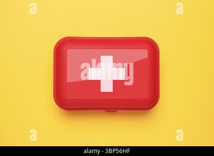 First Aid Kit on yellow background Stock Photo