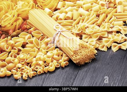 Mix of pasta on wood background Stock Photo