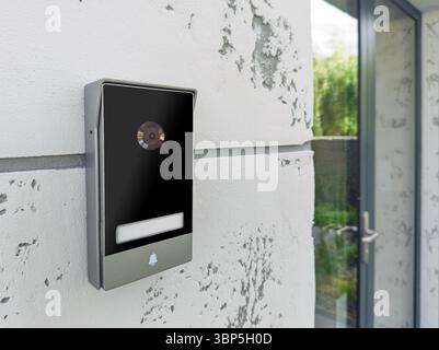 Smart doorbell with camera on modern wall Stock Photo