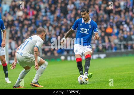 06 July 2025. Glasgow, UK. Rangers played Club Brugge in a pre season friendly football match at Ibrox stadium, Glasgow, Scotland. The final score was Rangers 2 - 2 Club Brugge. Jefte Vital da Silva Dias (R22) kicks the ball towards the Brugge goals  and it is defended by Michal Skoras (B21).  Findlay / Alamy Live News Stock Photo