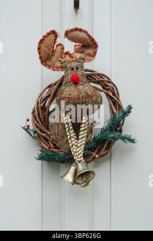 Decorative Christmas reindeer wreath hangs on a front door of a house in Kensington, London, England, United Kingdom, UK Stock Photo