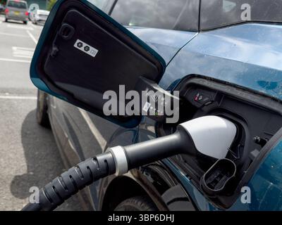 Electric Vehicle Plugged into IONITY High-Power Public Charging Point Delivering Ultra-Fast Charging up to 350kW England UK Stock Photo