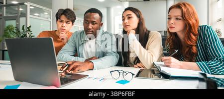 Diverse goup of focused multicultiral people using pc at office Stock Photo