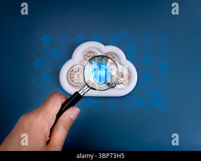 AI cloud computing infrastructure technology, security data system storage service concept. AI shield icon focus in magnifying glass lens in hand, on Stock Photo