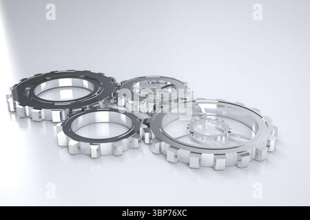 Four polished silver gears are interlocking on shiny grey surface in 3D render under soft lighting Stock Photo