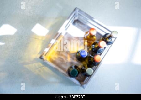 Overhead view of Various beer bottles in crate Stock Photo