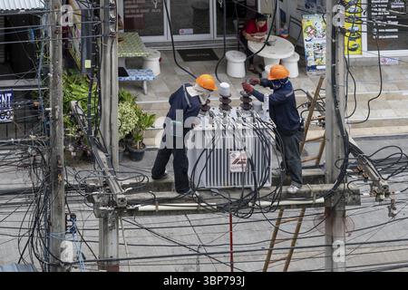 Electricians working on power lines, Pattaya, Thailand, Asia Stock Photo