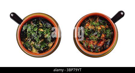 Food, Two clay pots containing steaming bowls of mussels garnished with fresh herbs, shot from above on a white background Stock Photo