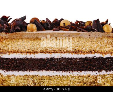 Food, Mouthwatering slice of cake is showing its delicious layers of sponge cake, chocolate mousse and white icing Stock Photo