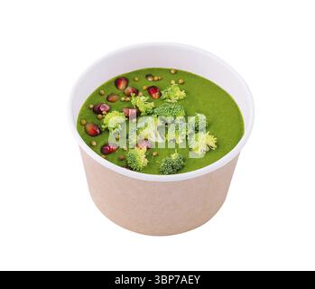 Food, Healthy vegan broccoli soup with pomegranate seeds, isolated on white Stock Photo