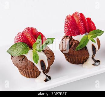 Food, Cupcakes with strawberries on white plate Stock Photo