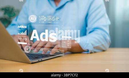 Businessman using laptop with virtual AI advertising interface, digital marketing and data analytics technology for online promotion and targeting. Stock Photo