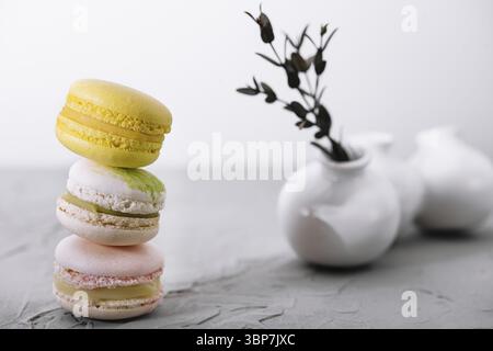 Food, Stack of french colorful macaroons on wooden table Stock Photo