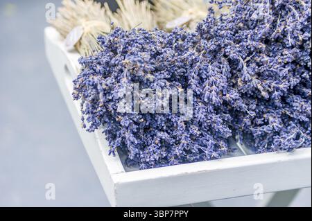 Bunches of dry lavender on wooden table Stock Photo