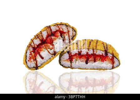 Food, Two sushi rolls cut in half lying on a white background, showing the ingredients Stock Photo