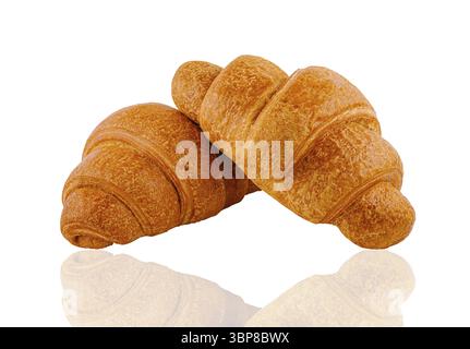 Food, Two delicious, golden-brown croissants are laying on a white background, showcasing their flaky texture and inviting aroma Stock Photo