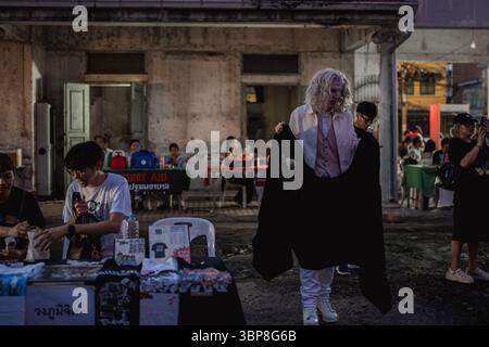 A performer dressed in a white suit with white hair and ghostly makeup interacts with visitors. The Bangkok Horror Film Festival 2025 took place over three nights at the Old Man Sii Waterworks (former Makkasan Water Facility), transforming the historic urban space into a gathering ground for horror cinema lovers. The event featured a diverse lineup of international and Thai horror films, immersive exhibitions, cosplay, and interactive installations. As one of the city's most visually striking cultural events this year, the festival highlighted Bangkok's thriving alternative film scene. Stock Photo