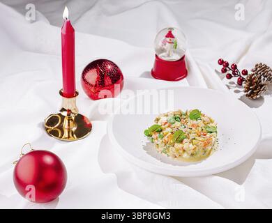 Food, A beautifully arranged table showcases delightful holiday dishes, surrounded by festive ornaments and a candle Stock Photo