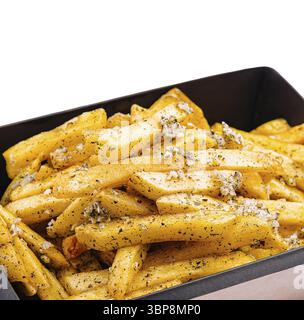 Food, Golden-brown fries are generously seasoned with herbs and spices, piled high in a black container. Perfect for a snack or side dish at any casua Stock Photo
