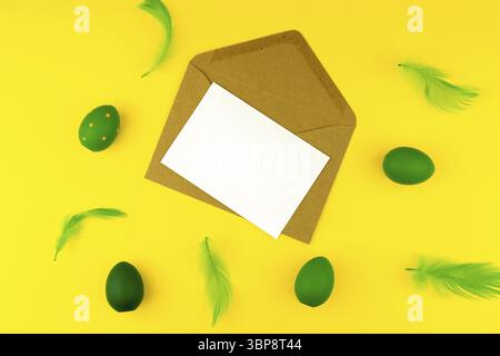 Spring Easter layout with green feathers and eggs, craft envelope and blank paper for text Stock Photo