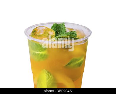 Food, Vibrant iced tea with lime slices and mint leaves in a clear cup, isolated on white background Stock Photo