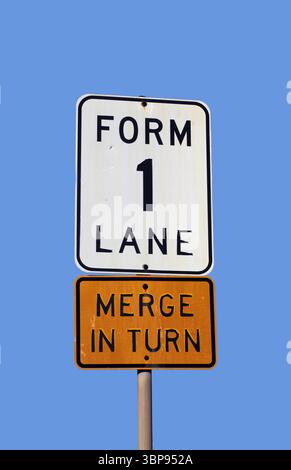 Road sign in the form of a white rectangle in a red circle. No entry ...
