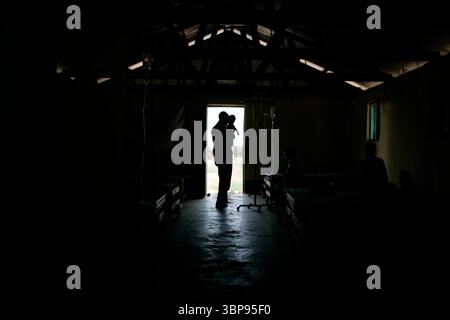 A man holds his baby at a clinic in Lira, Uganda. Stock Photo