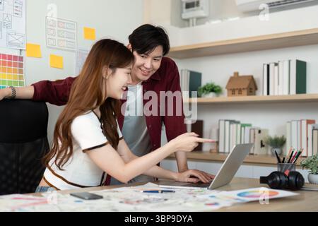 Collaborative UX and UI Design Review in Modern Office. Stock Photo