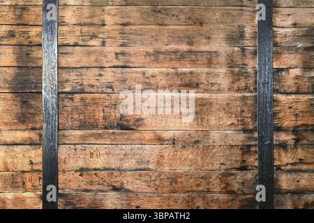 Rustic wooden planks with black metal iron stripes for vintage background Stock Photo