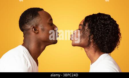 Black man and woman drawn to each other Stock Photo