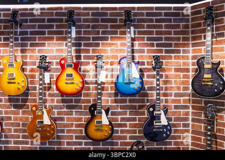 Colorful Les Paul Style Electric Guitars in Trendy Music Store. London, UK, 11 May 2024 Stock Photo