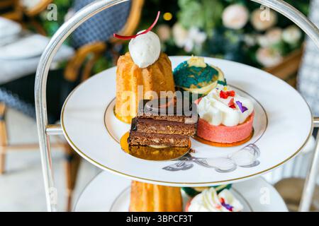 Afternoon tea cakes at the Dalloway Terrace, Bloomsbury Hotel, London, England Stock Photo