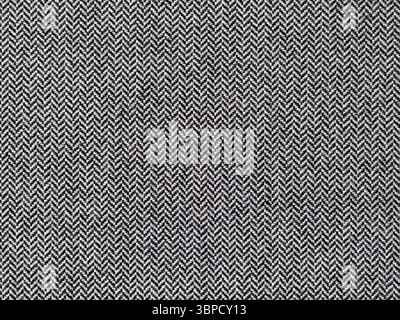 Herringbone or broken twill weave fabric pattern close-up. Texture of a textile material. Abstract background from the cloth surface. Stock Photo