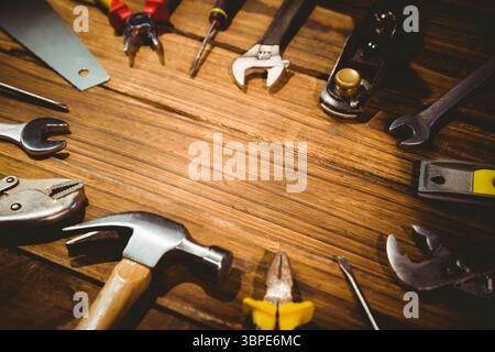 Flat design vector illustration is depicting hand tools arranged on wooden workbench, copy space Stock Photo
