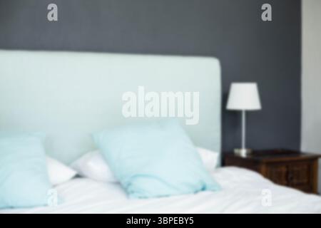 Defocused image of bed at home Stock Photo