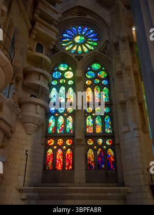 A beautiful modern stained glass window designed by Joan Vila-Grau inside Antoni Gaudí's La Sagrada Familia basilica in Barcelona, Spain. Stock Photo