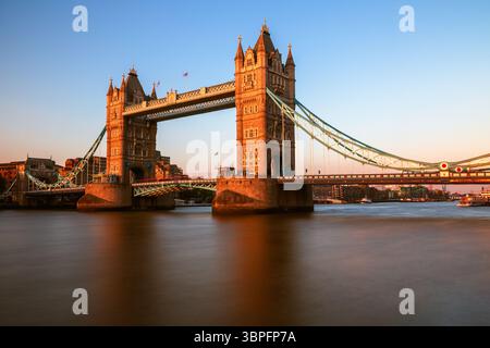 Long exposure, Tower Bridge over river Thames in London at sunset Stock Photo