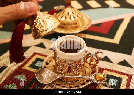 Cup of Hot Turkish Coffee Served on the Table Stock Photo