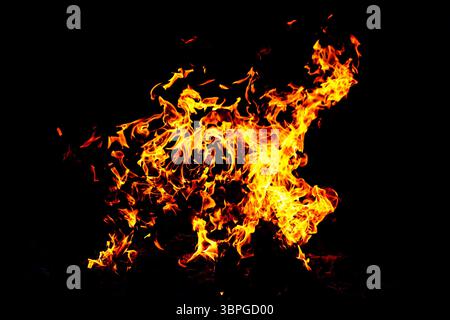 Fire flame texture. Burning material backdrop. Burn effect pattern. Blaze and torch wallpaper. Heat and haze backdrop. Exploison and hot background. Stock Photo
