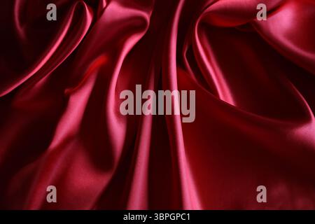 Ripples in red silk fabric Stock Photo