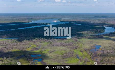 Amazing drone aerial view of Xingu river and Amazon rainforest trees in Xingu indigenous land, Brazil. Concept of environment, ecology, conservation Stock Photo