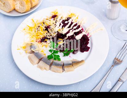 Beetroot served with cheese and pickled mackerel Stock Photo